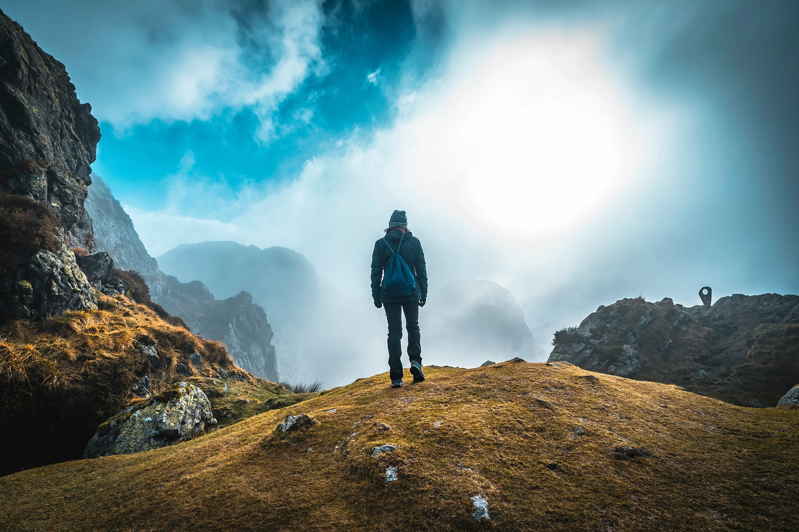 girl on mountain looking at horizon